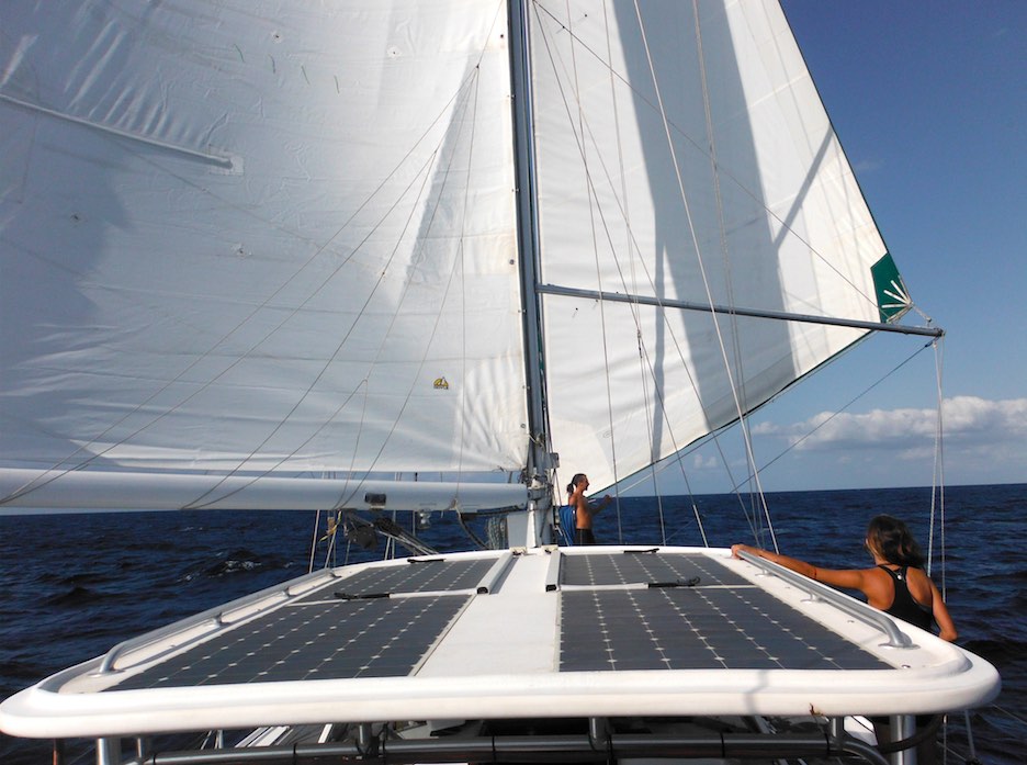 Sailboat with sails flying in the breeze